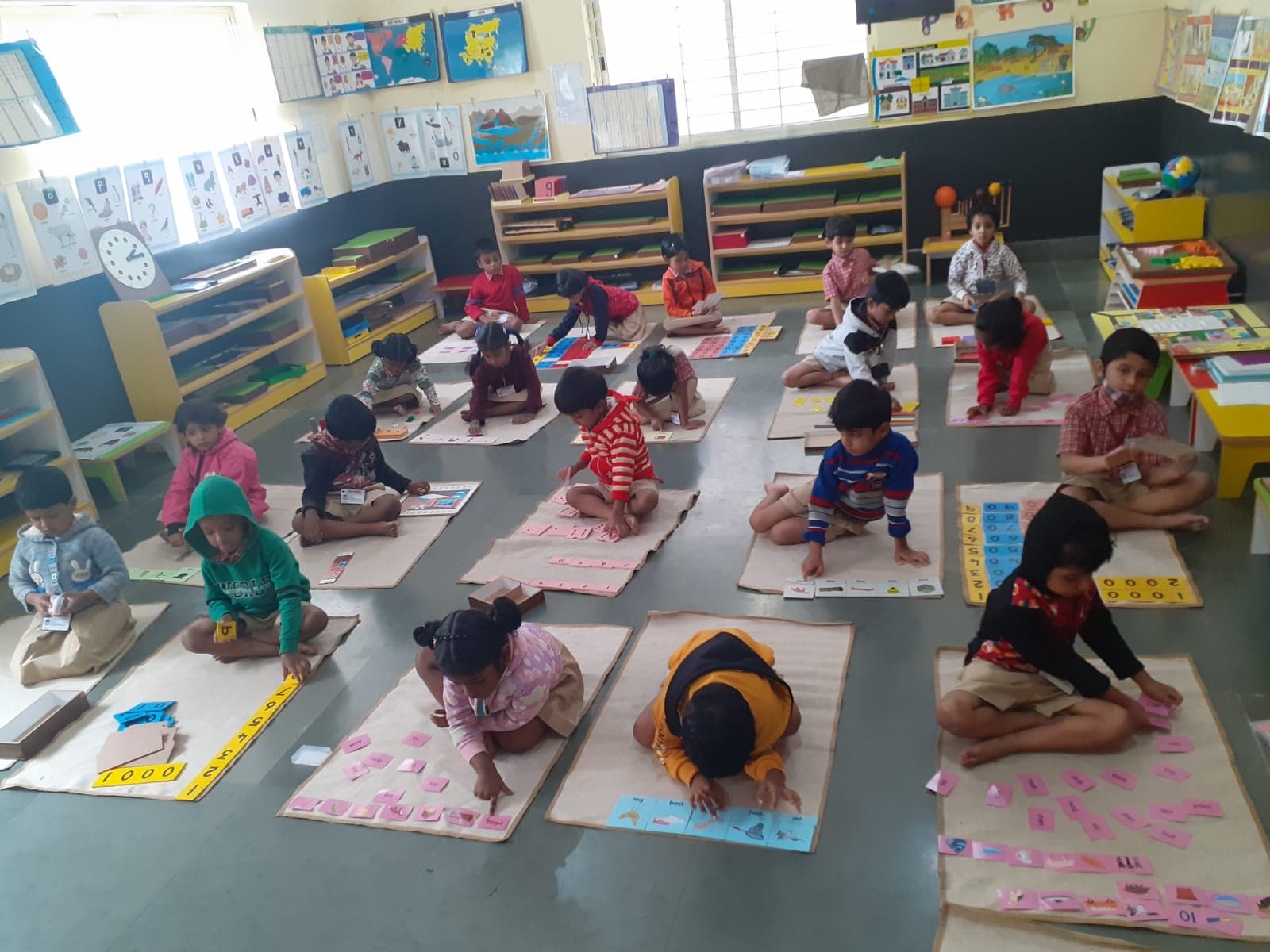 Kids Kingdom classroom with children on floor mats