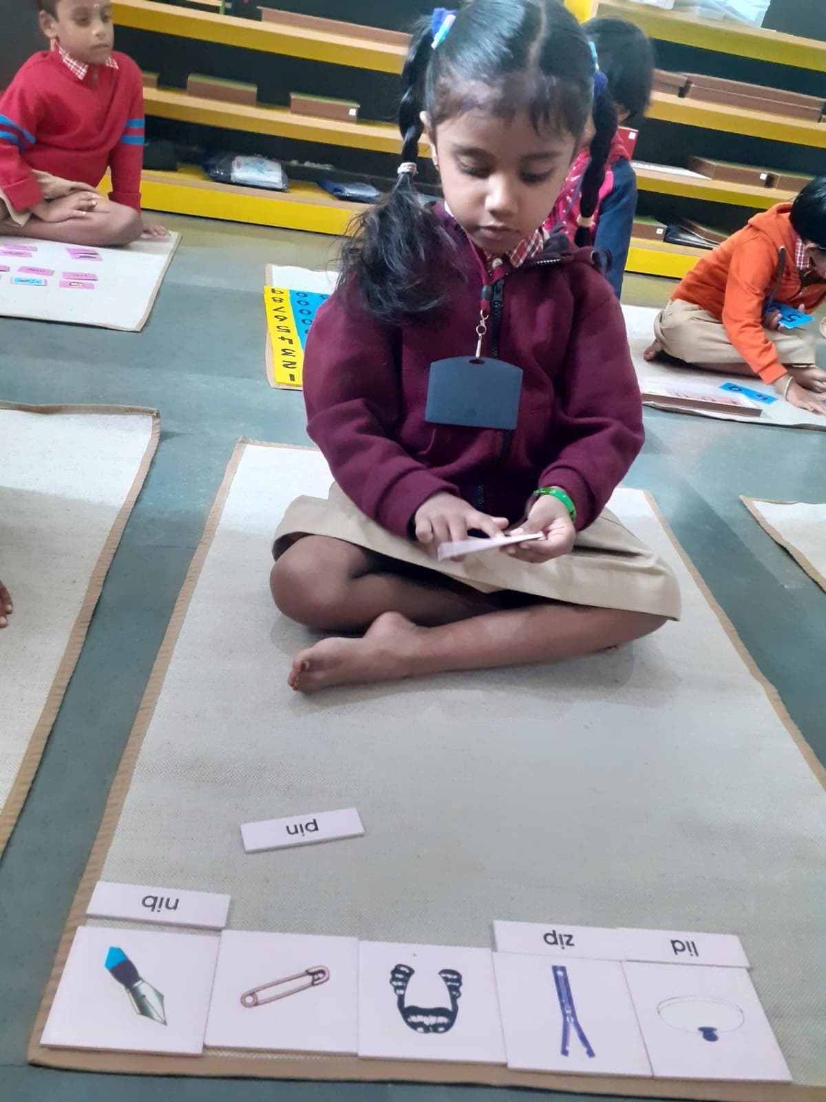 Child learning phonics with picture-word matching